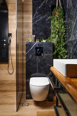 a bathroom with a white toilet and a sink at Mimosa Urban Habitation in Chania Town