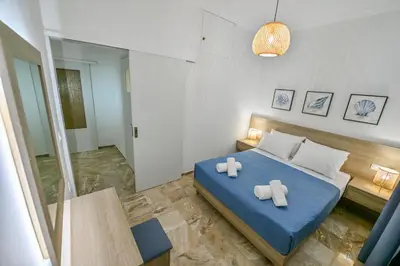 a bedroom with two teddy bears on a bed at Blue Horizon Kisamos Deluxe Apartment in Kissamos