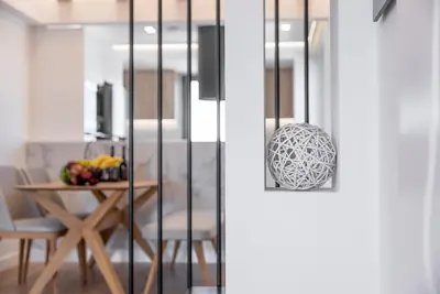 a dining room with a table with a bowl of fruit at Almy Luxury Apartments in Chania Town