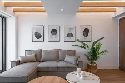 a living room with a couch and a table at Almy Luxury Apartments in Chania Town