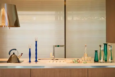 a kitchen counter with vases and a sink with a window at Conte Marino Villas in Maleme