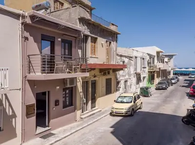 a car parked on the side of a street with buildings at Crescendo City House in Chania Town