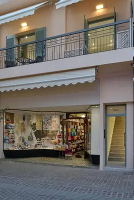 a store front of a building with a balcony at Amara Porto Living in Chania Town