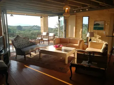 a living room with a couch and a coffee table at Villa Catani in Kalamaki Chanion