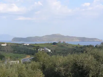 a view of a lake from a hill with trees at Villa Catani in Kalamaki Chanion