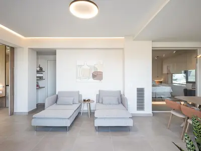a living room with two couches and a table at Mondethea vantage point home in Chania Town