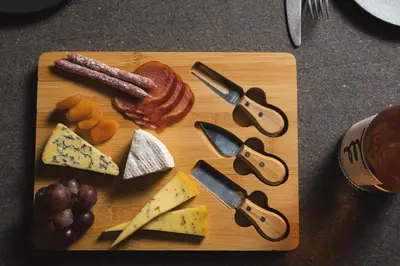 a cutting board with different types of cheese and meats at Urban Lofts in Chania Town