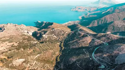 an aerial view of the mountains and the ocean at Lefteris Rooms in Kámbos