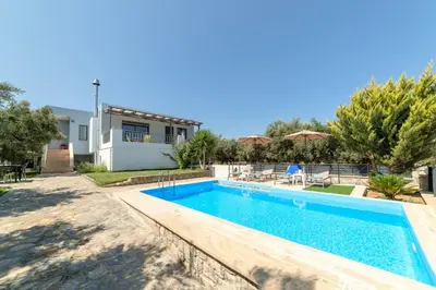 a villa with a swimming pool and a house at Villa Gianta in Kissamos