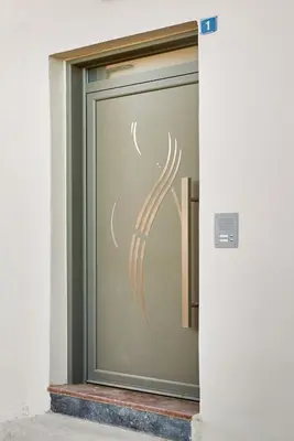 a glass door with a drawing of a virus on it at Bella Apartment in Kissamos