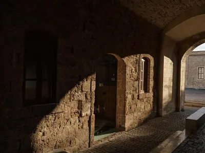 an alley with a door in a stone building at The Chania Hotel Crete, Vignette Collection in Chania Town