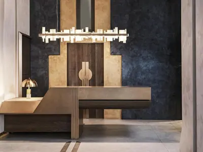 a dining room with a table and a chandelier at The Chania Hotel Crete, Vignette Collection in Chania Town