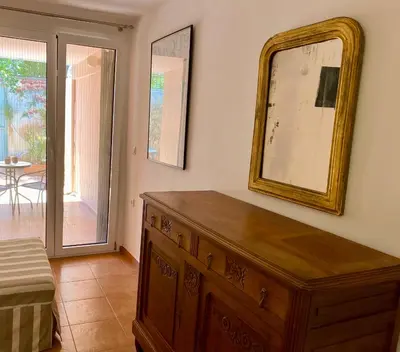 a room with a dresser and a mirror on the wall at RITSA ART RESIDENCE in Chania Town