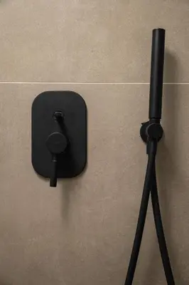 a black object on the side of a wall with a microphone at Ontas IK18 in Chania Town