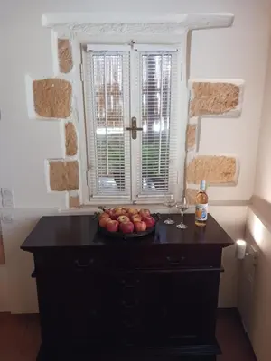 a bowl of apples on a table in a kitchen at casa di nonna in Chania Town