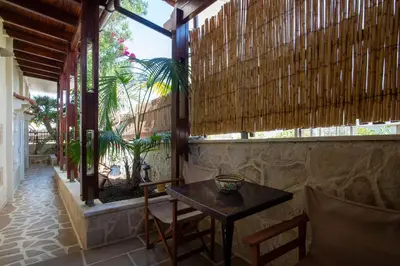 a room with a table and chairs and a window at casa di nonna in Chania Town