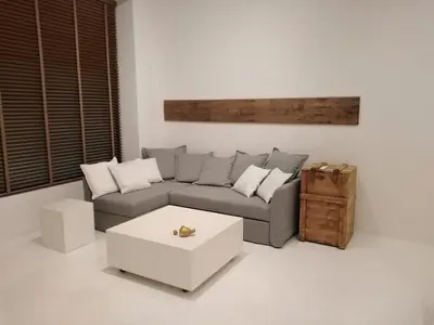 a living room with a couch and a coffee table at Fourteen All Seasons House in Chania Town