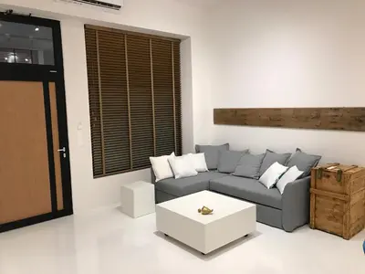 a living room with a couch and a coffee table at Fourteen All Seasons House in Chania Town