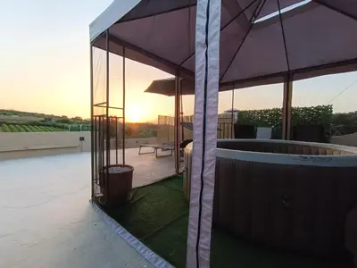 a hot tub on the roof of a house at Vrachakia Elegant in Ayiá