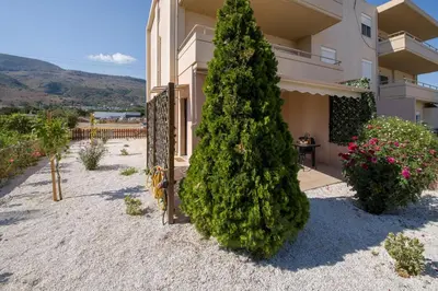 a large christmas tree in front of a building at Peris #1 - Souda in Souda