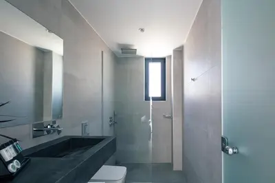 a bathroom with a sink and a toilet and a shower at Ikritis Villas in Chorafakia