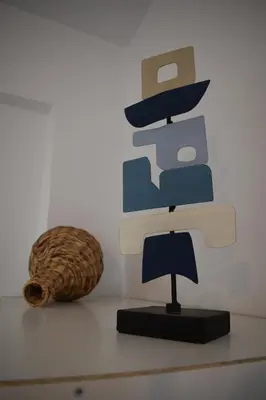 a piece of art on a wall next to a basket at Panorama Sea View Apartment in Beritianá