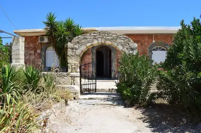 a brick house with a gate in front of it at Panorama Sea View Apartment in Beritianá