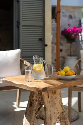 a table with a jug of lemonade and glasses on it at The Violin House in Chania Town