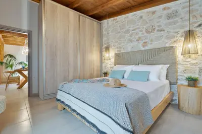 a bedroom with a bed with a hat on it at The Violin House in Chania Town