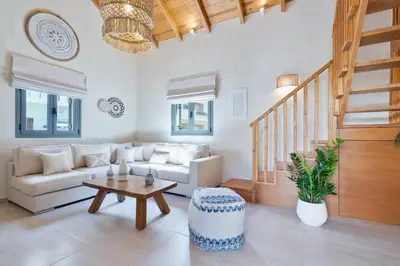 a living room with a couch and a table at The Violin House in Chania Town