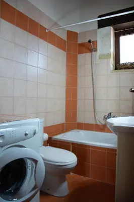 a bathroom with a toilet and a sink and a shower at VILLA MICHAELA in Gramvousá