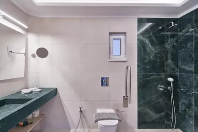 a bathroom with a shower and a toilet and a sink at El Platanias in Chania Town