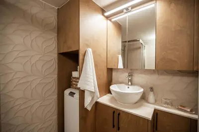 a bathroom with a sink and a mirror at Cretan Sea View Apt 8mins to beach,old town, city in Chania Town