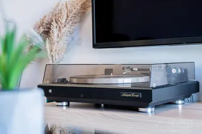 a record player sitting on a table under a tv at Yiannis Deluxe Apartment in Chania Town