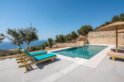 a villa with a swimming pool and a patio at Alma Natura Villas Falasarna- Avgerinos Villa in Falasarna