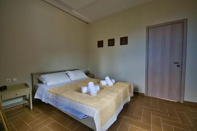 a bedroom with a bed with two towels on it at West Crete House in Kámbos
