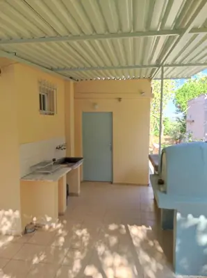 a room with a kitchen with a ceiling at Anatolika Stamatis Paradise in Dhémbla