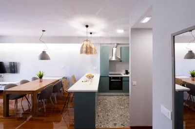a kitchen and dining room with a table and chairs at Chania Central Apartment in Chania Town