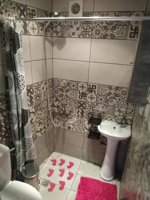 a small bathroom with a sink and a shower at Chrisi Traditional House in Néon Khoríon