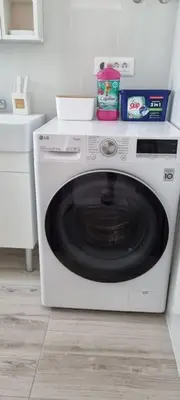 a white washing machine sitting in a kitchen at MAGIC VIEW APARTMENT in Chania Town