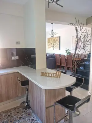 a kitchen and dining room with a table and chairs at Villa Vanessa in Kissamos