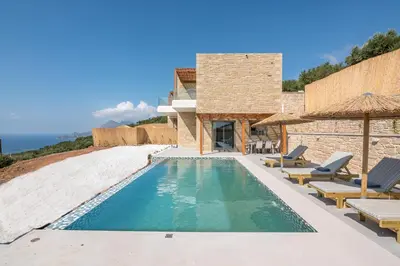 a villa with a swimming pool and patio furniture at Alma Natura Villas Falasarna - Aposperitis Villa in Falasarna