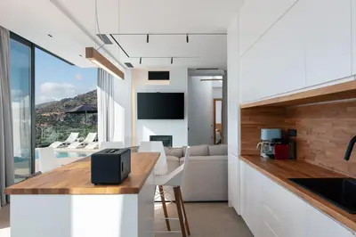 a kitchen and living room with a view of a living room at Villa Anasa in Palaiochóra