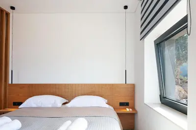 a bedroom with a bed and a window at Villa Anasa in Palaiochóra