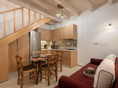 a living room with a couch and a table at Vaggelis house in Chania Town