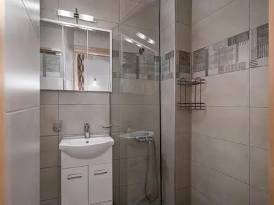 a bathroom with a sink and a shower at Vaggelis house in Chania Town