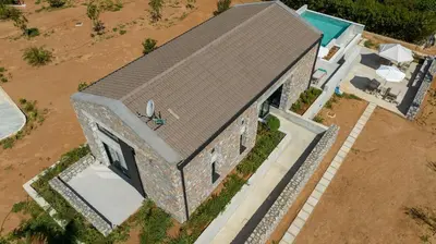 an overhead view of a house with a roof at Fairytale Villas in Souda