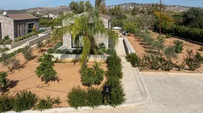 an overhead view of a garden with trees and bushes at Fairytale Villas in Souda