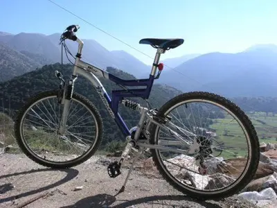 a bike parked on the side of a mountain at Panorama Askifou in Karés