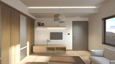 a living room with a table and a tv at Elafonisi Resort by Kalomirakis Family in Elafonisi